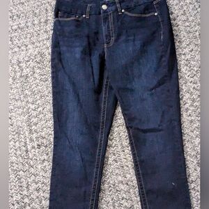 Dark blue jeans made by seven established in 1964